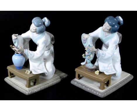 Two 20thC Lladro figures of a Geisha, each arranging flowers, 22cm H, and a Lladro box.