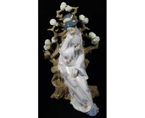 A 20thC Lladro figure of a Geisha, on naturalistic setting, no.1807, printed and impressed marks beneath, 32cm H, with two as