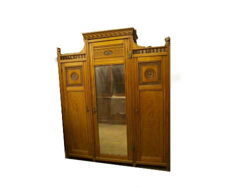 A late Victorian aesthetic movement light ash wardrobe compactum and dressing table by Shapland &amp; Petter, the wardrobe ha