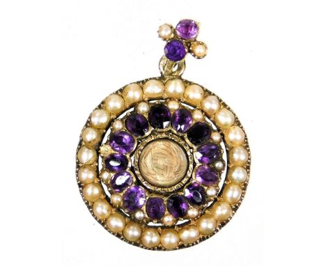 A Victorian memorial pendant, set with layers of amethyst and seed pearls, with locket memorial panel centre, bearing inscrip