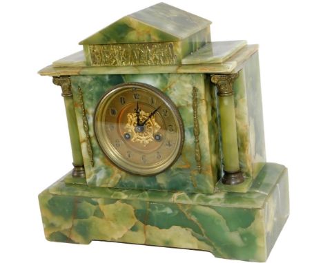 A Victorian green marble type mantel clock, the 10cm Dia. Arabic dial with a partial exposed movement, in a classical case fl