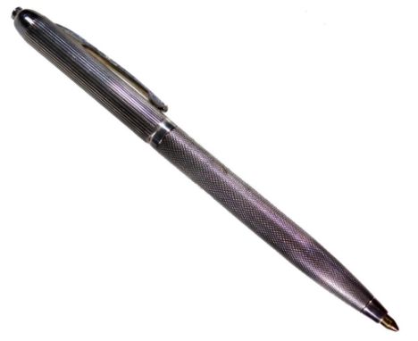 An Elizabeth II silver ball point pen, with engine turned body and plain clip, Birmingham 1956, 13cm W, in associated case.