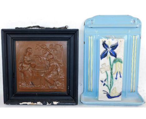 A 19thC cast iron plaque, of a religious scene, painted brown, in ebonised frame, 43cm x 40cm, and an enamel and tile bathroo
