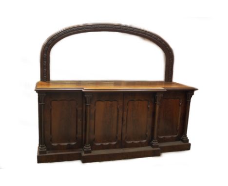 A Victorian mahogany mirror back breakfront sideboard, with floral carved and double moulded arched plate, double moulded top