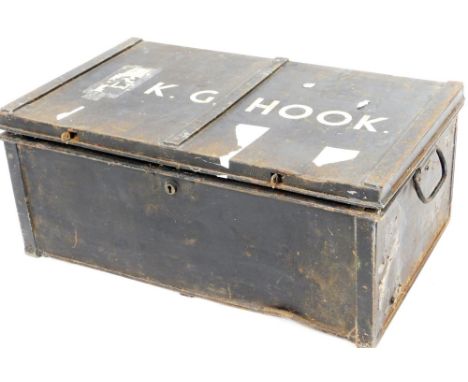 An early 20thC tin trunk, with side carrying handles, marked K G Hook, with plain interior and two army issue canvas bags wit