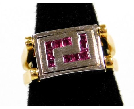 A two way design ring, the central rectangular panel set with tiny diamonds (one missing) to one side, and square cut rubies 