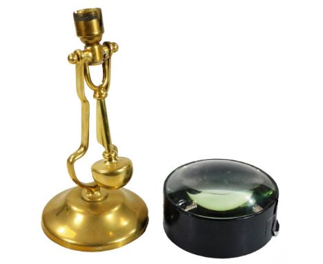 An early 20thC brass ships lamp, with wall attachment and gimbal stamped A.P 9009, and a large lens. (2) 