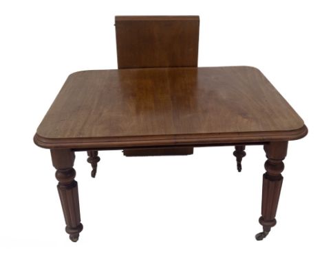 A Victorian mahogany wind out dining table, with double moulded top, reeded taper legs with brass and ceramic castors, 105cm 
