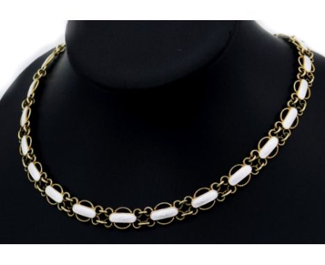 A silver gilt and enamel Danish silver necklace, each link of twist design with central oval white enamel panel depicting a f