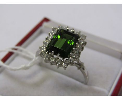 18CT WHITE GOLD GREEN TOURMALINE &amp; DIAMOND RING, emerald cut green tourmaline stone in excess of 3cts surrounded by well 