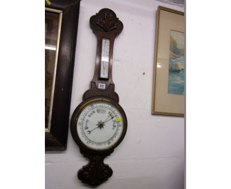 EDWARDIAN ANEROID BAROMETER, carved oak frame with thermometer 