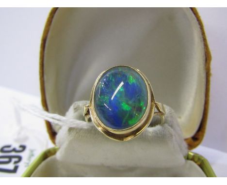 VINTAGE STYLE BLACK OPAL RING, oval cut black opal set in 9ct yellow gold simple rub over mount, large opal approx 17mm x 14m