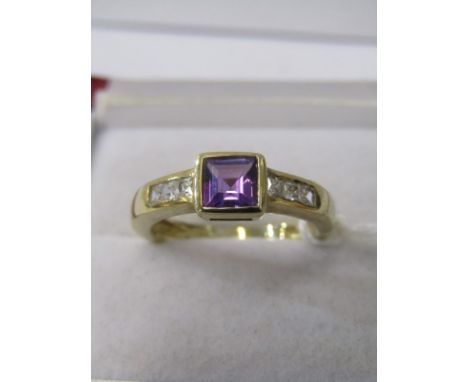 9CT YELLOW GOLD AMETHYST DRESS RING, princess cut amethyst with approximately 0.66ct set with accent princess cut stone to ea