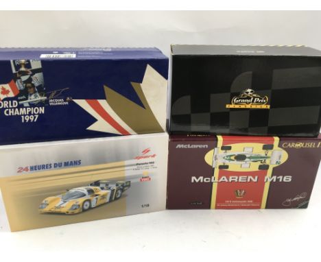 A collection of boxed Diecast vehicles including Formula 1 racing and LeMans racing all limited edition 1:18 scale