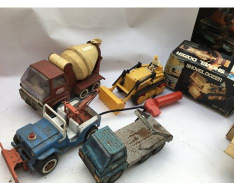 Tonia toys , cement mixer, Jeep wrecker , with hoist and plough , Skip lorry and a Hercules boxed remote control Shovel Dozer