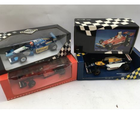 A collection of boxed, Formula 1 racing, Diecast vehicles including Ferrari, Williams etc 1:18 scale, x4