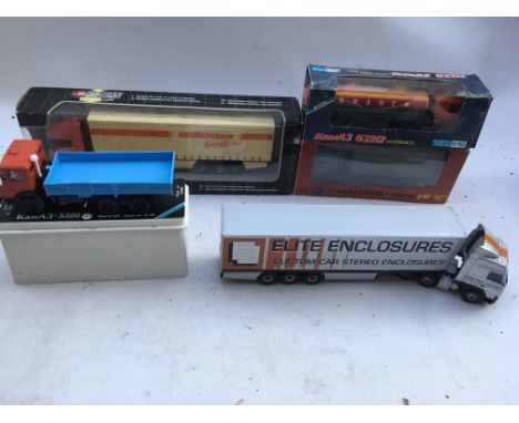 A collection of boxed Diecast vehicles including 3x 1:43 scale lorries made by a company in USSR, a Wilkinson truck boxedand 