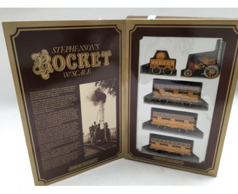 Hornby railways, OO scale , boxed Stephensons rocket, including rocket locomotive and tender with 3 coaches
