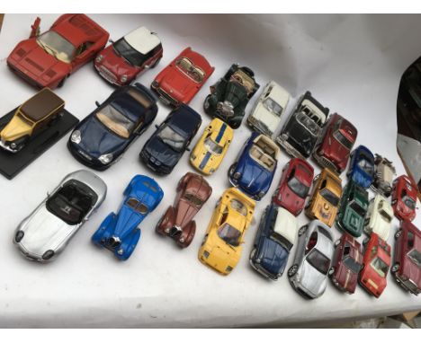 A collection of loose Diecast vehicles including 1:18 and 1:24 scale models of Ferrari, Rolls Royce, Porsche, BMW, Mercedes B