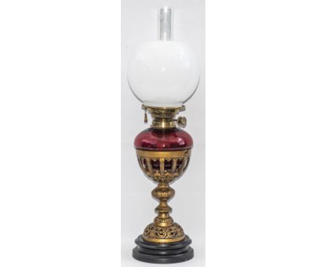 London &amp; South Western Railway table oil lamp with ornate cast iron base with SWR cast underneath, Cranberry glass reserv