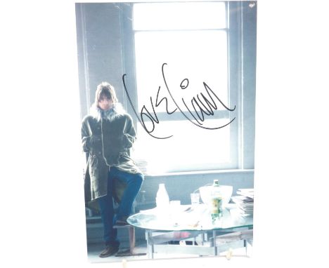 Signed Liam Gallagher photograph, with CoA from London Town collectables. P&amp;P Group 1 (£14+VAT for the first lot and £1+V