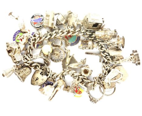 Hallmarked silver charm bracelet with 925 silver charms and padlock clasp, L: 18 cm, combined 93g. P&amp;P Group 1 (£14+VAT f