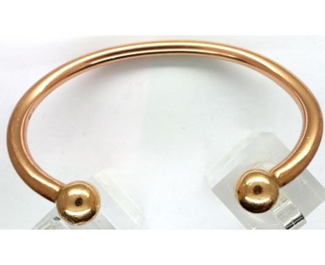 9ct gold torque bangle, D: 75 mm, 44.4g. general usage marks otherwise good condition. P&amp;P Group 1 (£14+VAT for the first