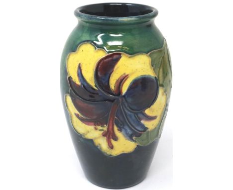 Moorcroft vase in the Hibiscus pattern, H: 11 cm, crazing and surface marks throughout, no cracks or chips. P&amp;P Group 1 (