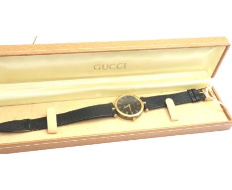 GUCCI: boxed wristwatch on a leather strap, requires battery. P&amp;P Group 1 (£14+VAT for the first lot and £1+VAT for subse