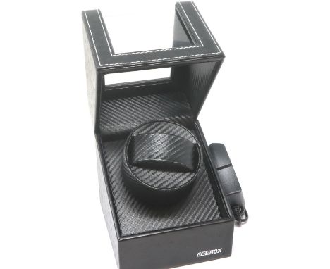 New and boxed automatic watch winder, with power supply. P&amp;P Group 1 (£14+VAT for the first lot and £1+VAT for subsequent