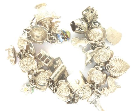 925 silver/white metal charm bracelet with eighteen charms, some hallmarked silver, chain L: 16 cm, combined 55g. P&amp;P Gro