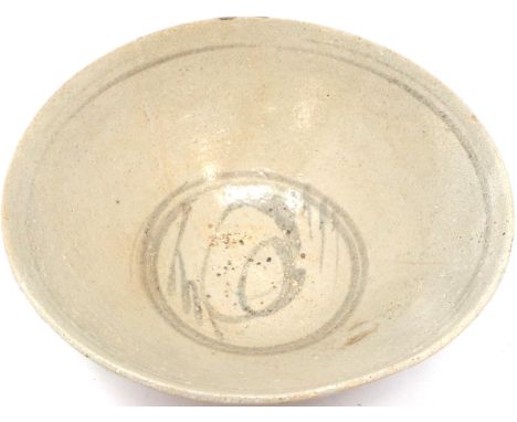A Ming Dynasty glazed bowl, decorated with a dark blue script in the basin, D: 13 cm, H: 5 cm. P&amp;P Group 1 (£14+VAT for t