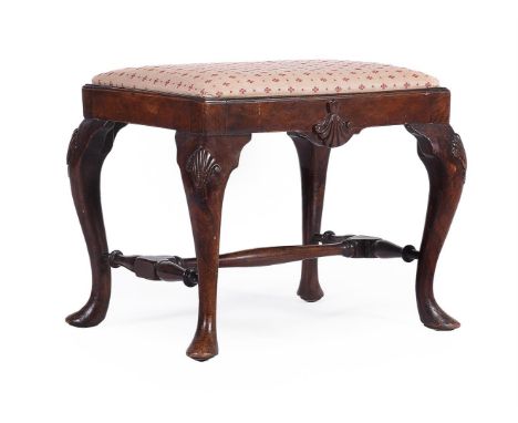 A CARVED MAHOGANY STOOL IN GEORGE II IRISH STYLE  LATE 19TH CENTURY Upholstered in the Marvic Textiles 'Clover Ochre' fabric 