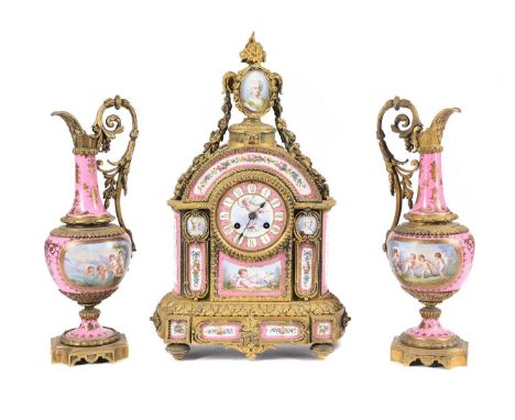 A FRENCH GILT METAL MOUNTED AND PINK PORCELAIN SEVRES STYLE CLOCK GARNITURE  LATE 19TH CENTURY With eight-day bell striking m