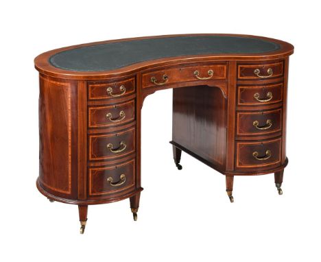 AN EDWARDIAN MAHOGANY AND INLAID KIDNEY SHAPED WRITING DESK CIRCA 1905 With brass label to interior of the drawer for S & H J