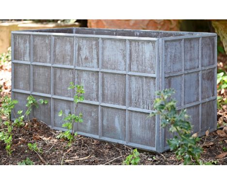 A RECTANGULAR LEAD GARDEN PLANTER 20TH CENTURY Of rectangular panelled form 50cm high, 102cm wide, 54cm deepTogether with ano