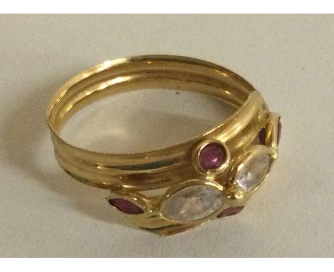 A small Continental 18 carat gold ruby and diamond mounted ring. Approx. 2 grams. Est. £50 - £80.