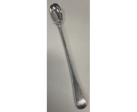 A very large silver condiment spoon with feather edge. London 1928. By Garrard. Approx. 40 grams. Est. £40 - £60.