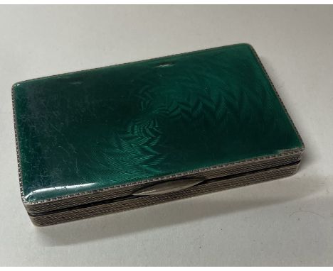 A silver and green enamelled snuff box. Import marked. Approx. 95 grams. Est. £150 - £200