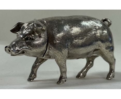 A large silver figure of a pig with lift off lid. Marked on body and part marked to head. By Bernold Muller 1910. Approx. 175