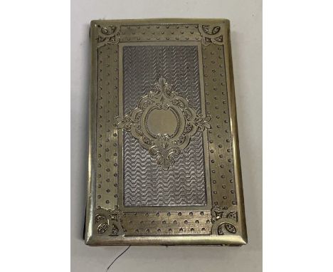 An engine turned silver gilt travelling card case. Approx. 52 grams. Est. £150 - £200.