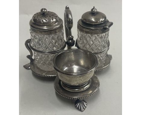 A Victorian silver condiment set on a stand. Sheffield 1862. By Henry Wilkinson &amp; Co. Approx. 126 grams. Est. £100 - £150