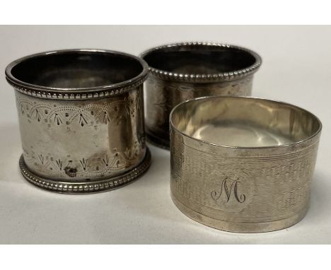 A good group of three silver napkin rings. Approx. 85 grams. Est. £30 - £50.