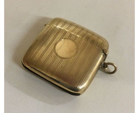 A 9 carat engine turned vesta case. Approx. 21 grams. Est. £300 - £500.