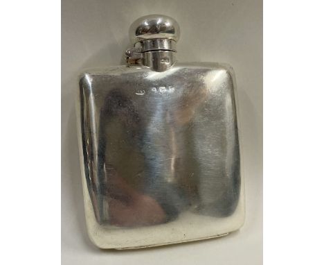 An Art Deco silver hip flask. Birmingham 1906. Approx. 88 grams. Est. £200 - £300.