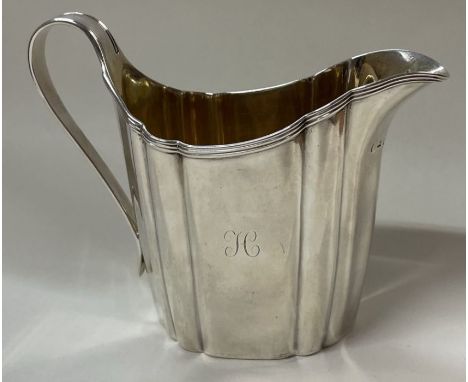 A George III silver reeded jug. London 1803. Approx. 146 grams. Est. £100 - £150.