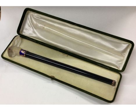 A fine boxed silver cane mount of tapering form in the form of a rabbit with gold and enamelled collar. Est. £800 - £1200.