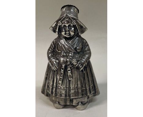 A fine oversized silver figural pepper in the form of a lady. Marked to base. c1900. Approx. 175 grams. Est. £300 - £500.