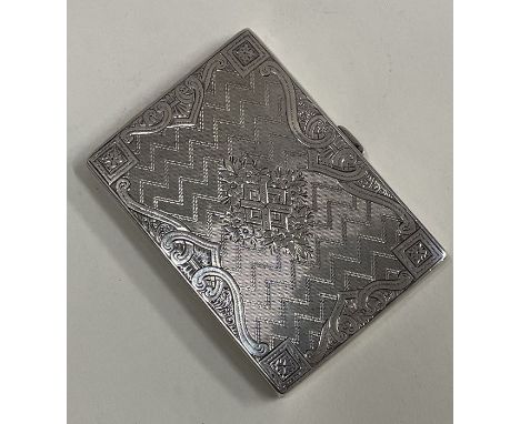 An engraved engine turned Victorian silver card case. Birmingham. By Hilliard and Thompson. Approx. grams. Est. £150 - £200.