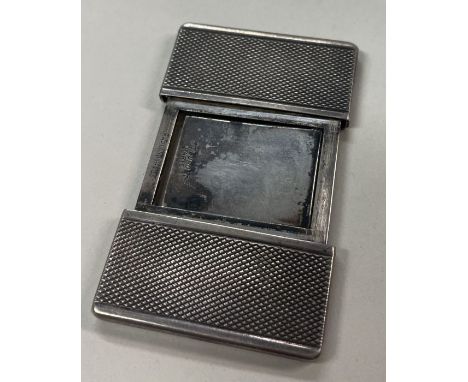 A French engine turned silver stamp case. Approx. 35 grams. Est. £30 - £50.